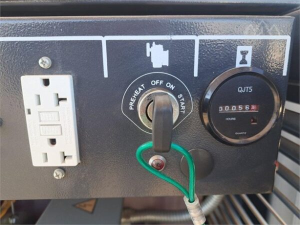 A close up of the power outlet and electrical panel.